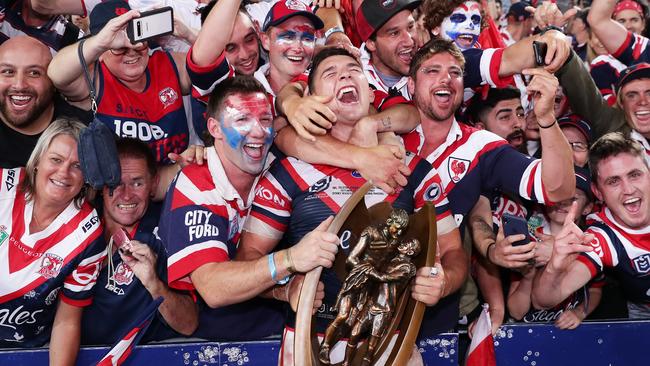 Local hero Victor Radley celebrates victory with fans after the grand final.