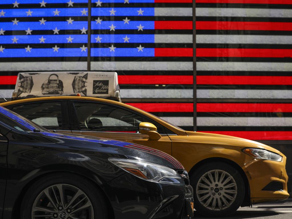 The bright lights of Times Square hint at America’s problems with consumerism, greed and failed dreams. Picture: Drew Angerer/Getty Images/AFP