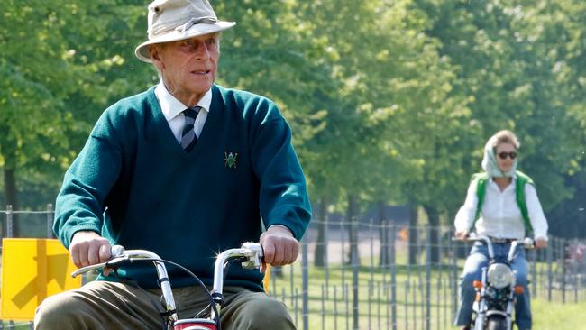 Prince Philip, Duke of Edinburgh and Penelope riding mini 'Easy-Rider' motorbikes on day 1 of the Royal Windsor Horse Show in Home Park in 2006. Picture: Max Mumby/Indigo/Getty