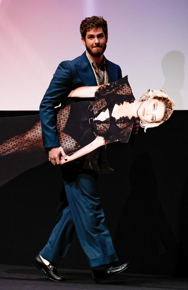 In lieu of an appearance by his co-star, Andrew Garfield carried a cardboard cutout of ‘We Live In Time’ premiere in London. Picture: John Phillips/Getty Images for BFI