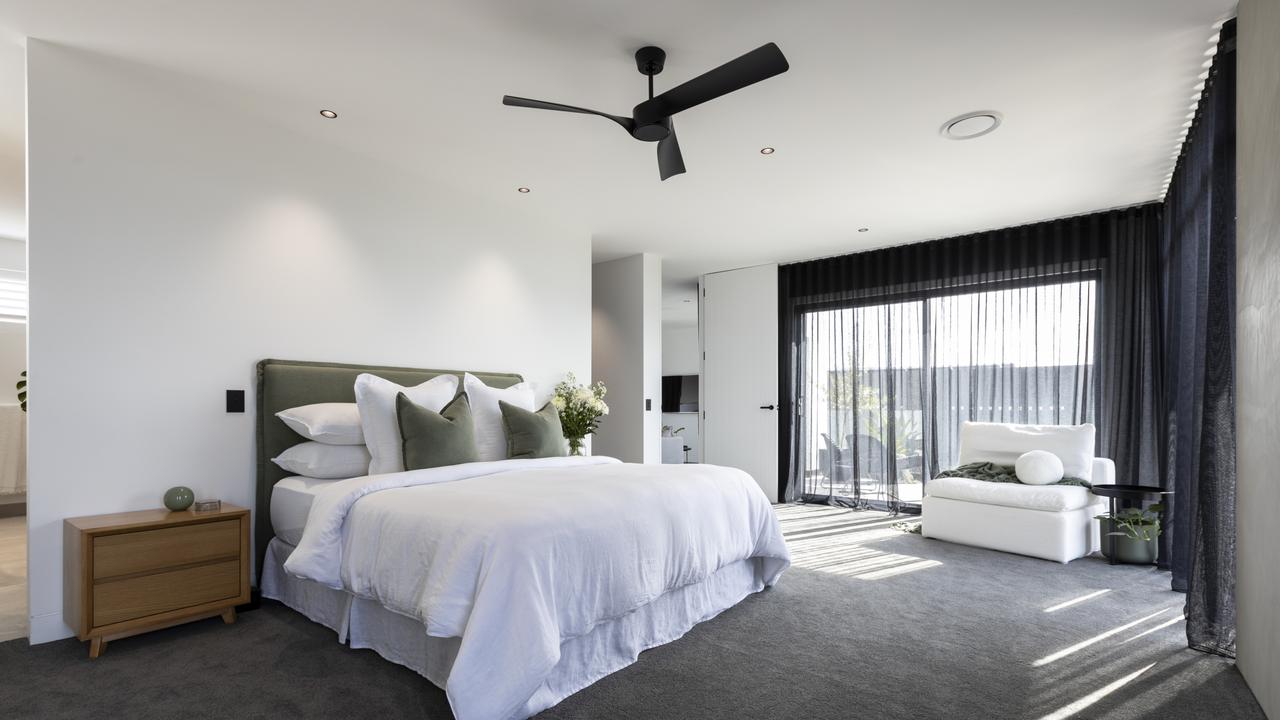 The master suite offers buyers a private retreat with a balcony.