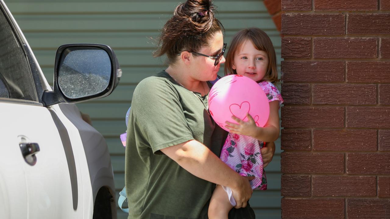 Cleo was carried inside a friend's house by her mother. Picture: Tamati Smith/Getty Images