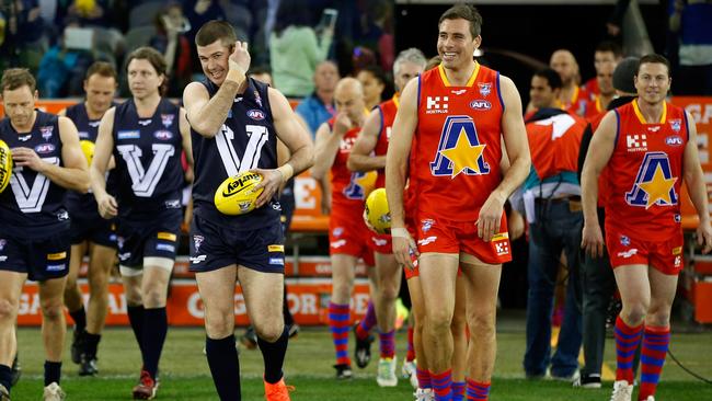 Victoria and the All Stars walk on to the field during the 2016 EJ Whitten Legends Game at Etihad Stadium. Picture: AFL Media