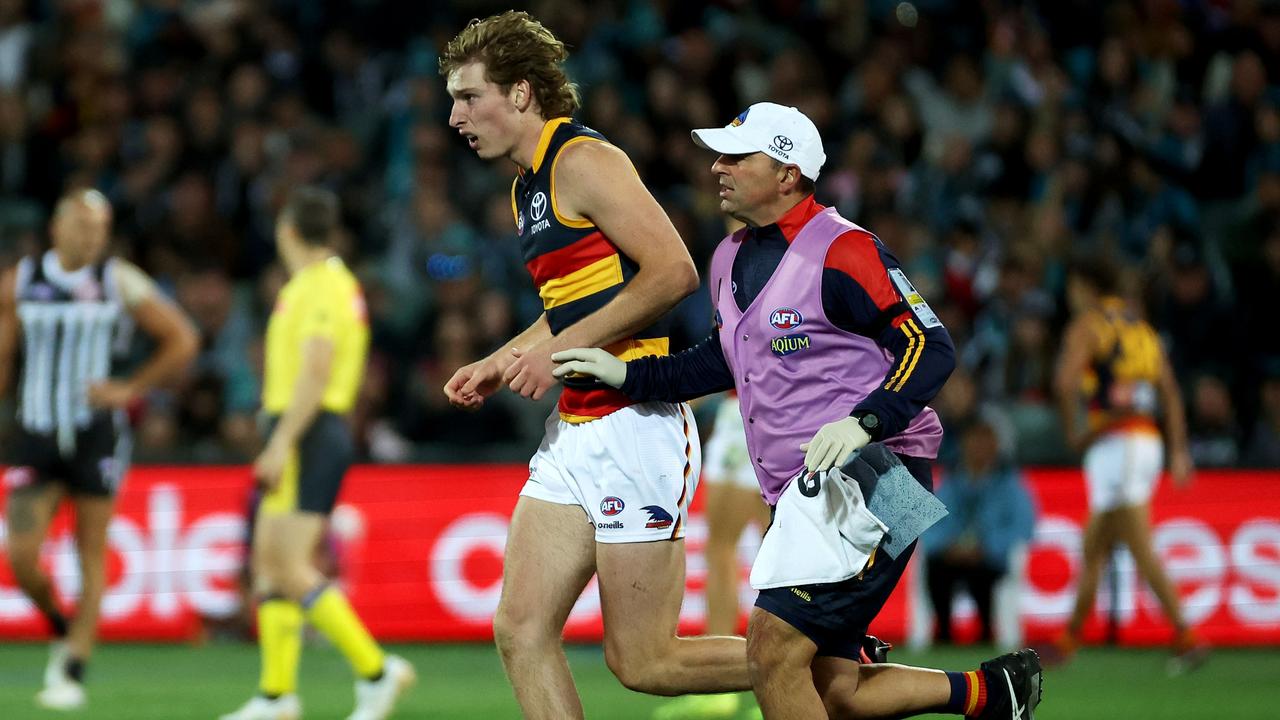 Michalanney is taken from the ground after the big hit. (Photo by James Elsby/AFL Photos via Getty Images)