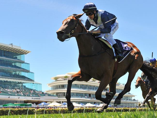 Jockey Joe Bowditch rides Lloyd Kennewell’s Jedastar to victory on New Year’s Day at Flemington. Picture: AAP Image/Quentin Lang