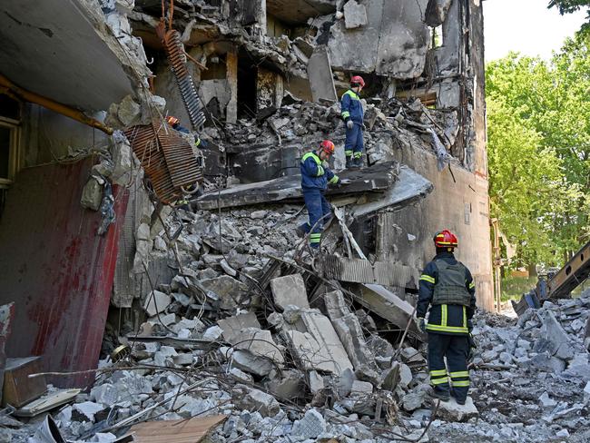 Rescuers dismantle the ruins of a residential building partially destroyed by shelling on the northern outskirts of second largest Ukrainian city of Kharkiv on June 4. Picture: AFP