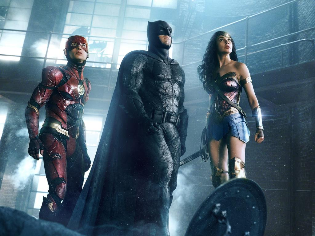 Ezra Miller as The Flash, Ben Affleck as Batman and Gal Gadot as Wonder Woman in a scene from Warner Bros’ Justice League.