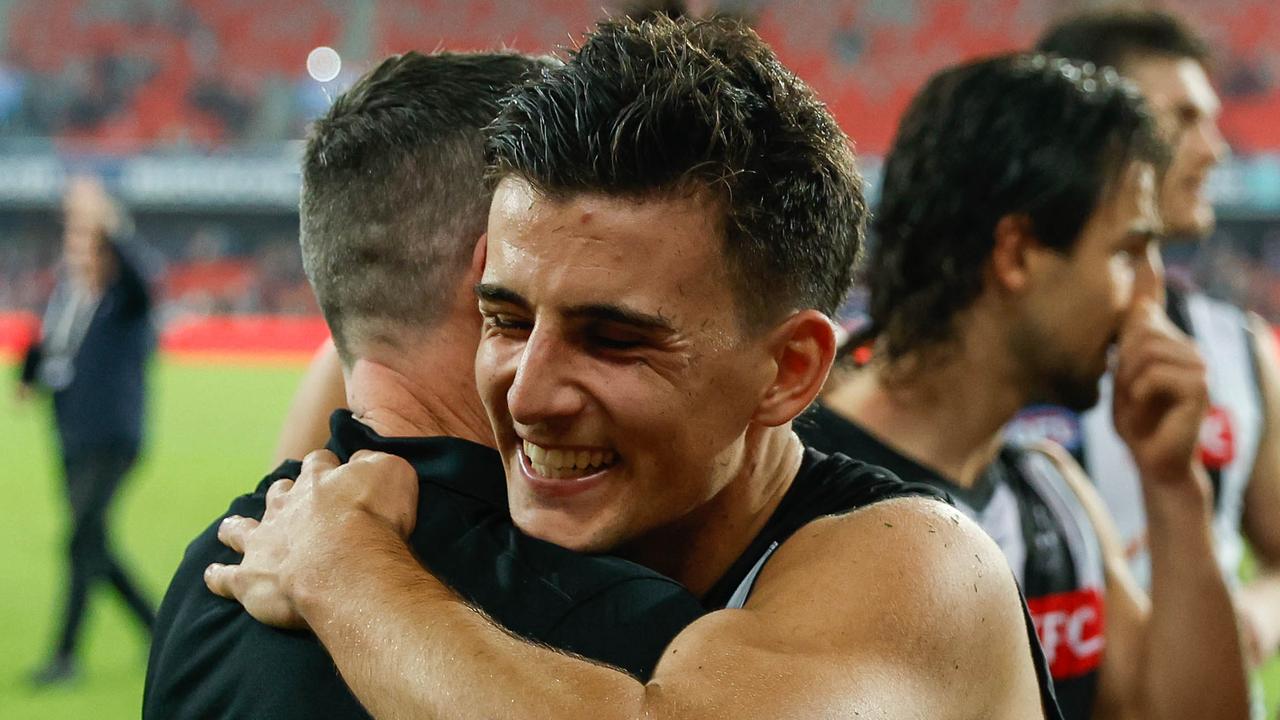 GOLD COAST, AUSTRALIA - JULY 02: Craig McRae, Senior Coach of the Magpies and Nick Daicos of the Magpies embrace after the 2022 AFL Round 16 match between the Gold Coast Suns and the Collingwood Magpies at Metricon Stadium on July 02, 2022 in Gold Coast, Australia. (Photo by Russell Freeman/AFL Photos via Getty Images)