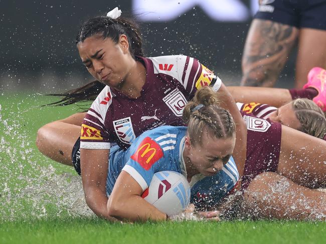 SYDNEY, AUSTRALIA - MAY 15: Abbi Church of the Blues is tackled during game two of the Women's State of Origin series between the New South Wales Blues and Queensland Maroons at Allianz Stadium on May 15, 2025 in Sydney, Australia. (Photo by Cameron Spencer/Getty Images) *** BESTPIX ***