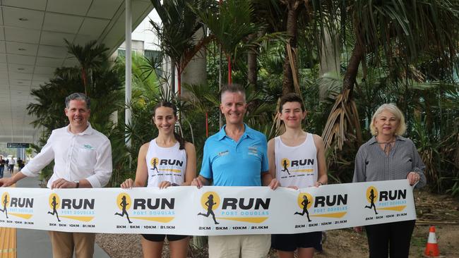 TTNQ chief executive officer Mark Olsen, Clare Robertson, Port Douglas Gran Fondo Managing Director Bade Stapleton, Luke Swindale and Douglas Shire Mayor Lisa Scomazzon get excited for the new Run Port Douglas event to make its Port Douglas Gran Fondo debut in September 2025. Photo: Catherine Duffy