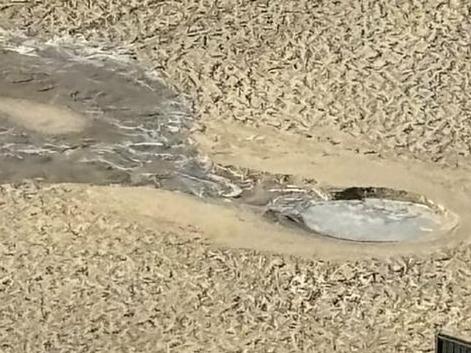 A two metre hole erupted in the middle of Main Beach. Picture: Supplied