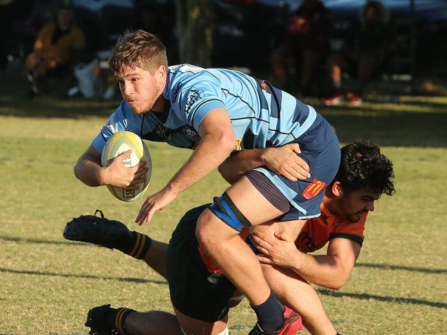 Helensvale Hogs vs Surfers Paradise Dolphins rugby union clash at helensvale hogs rugby club. Helensvale Player No7 Flynn Carson Surfers Player No6 Jackson Searl Pic Mike Batterham