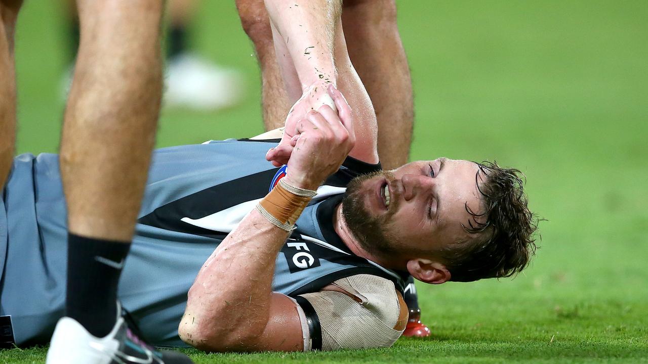 Trent McKenzie is injured before being stretchered off during the last quarter. Picture: AFL Photos/via Getty Images