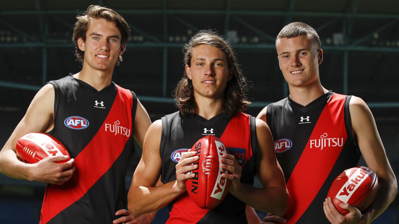 Essendon draftees Zach Reid, Archie Perkins and Nik Cox will all be aiming to break into the Bombers’ best 22. Picture: Dylan Burns/AFL Photos via Getty Images