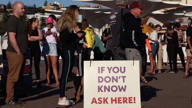 Voters queue outside a polling station on Bondi Beach in Sydney. Picture: David Gray/AFP