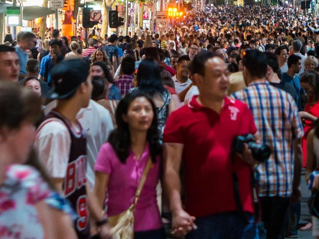 A crowd in Swanston Street, Melbourne during the 2015 White Night arts festival. population crowd generic