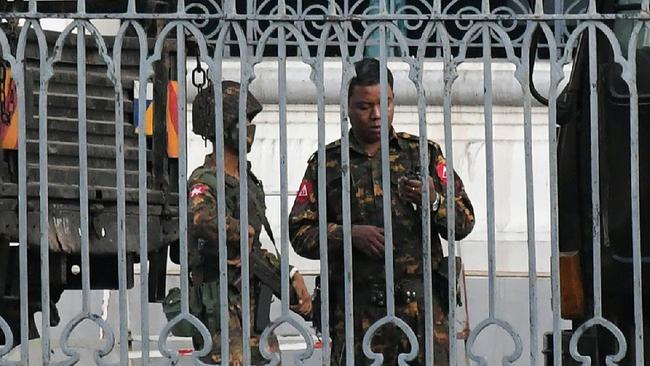 Troops guard city hall in Yangon on Monday. Picture: AFP