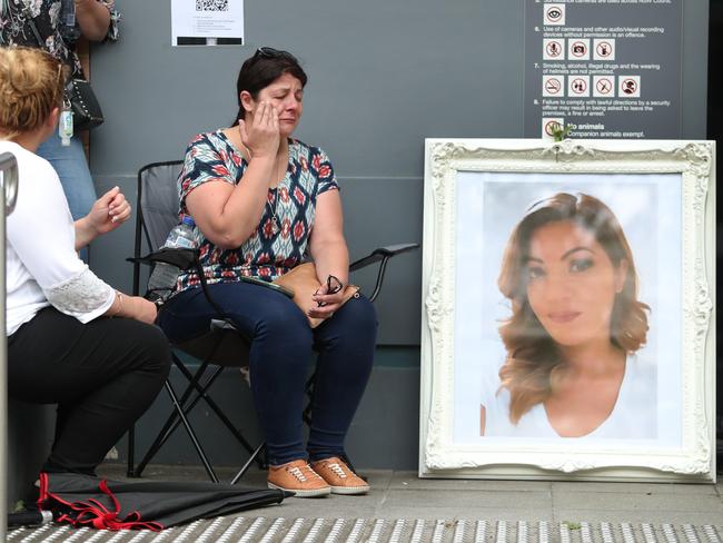 Hale Osman sits with a portrait of her daughter Yasemin outside Wyong Court Tuesday 19th January 2021.Driver Michael Wells is charged over death of Yasemin Osman. Picture: Sue Graham