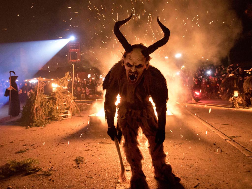 A participant performs during a procession of 'Krampus' monsters in Schwadorf, Austria. Krampus is traditionally the evil sidekick of Santa, sent to frighten naughty children and "evil spirits" in the run-up for Christmas. Picture: AFP