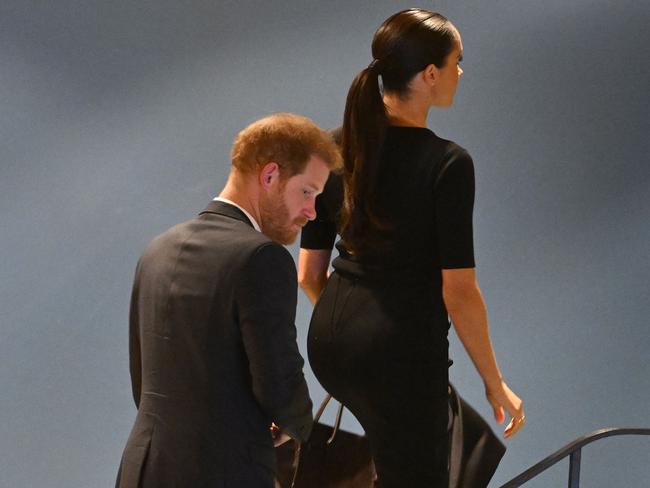 Prince Harry (L) and Meghan Markle (R), the Duke and Duchess of Sussex, leave the 2020 UN Nelson Mandela Prize award ceremony at the United Nations in New York on July 18, 2022. - The Prize is being awarded to Marianna Vardinoyannis of Greece and Doctor Morissanda Kouyate of Guinea. (Photo by TIMOTHY A. CLARY / AFP)