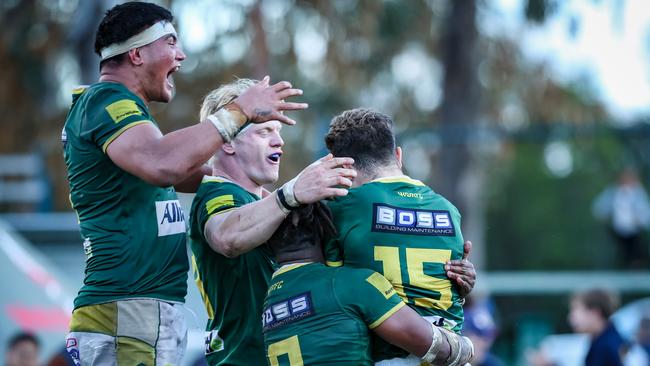 Moses Sorovi and teammates getting around Whiteside's equaliser. Pic: Brendan Hertel/QRU