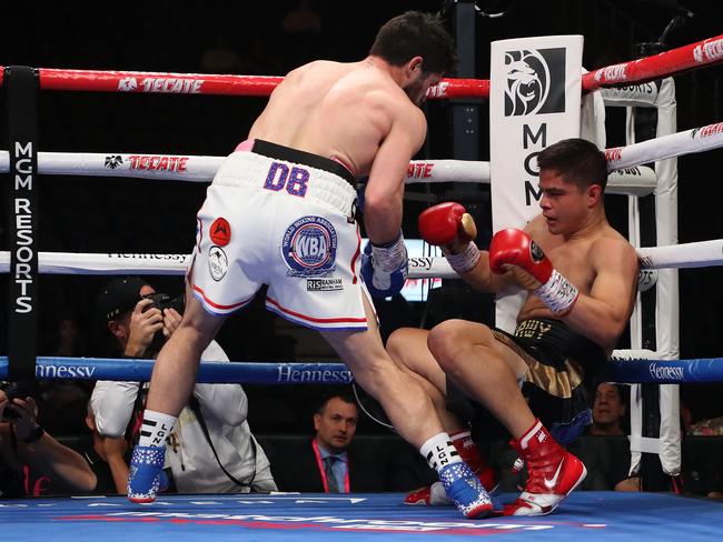 Bilal Akkawy is knocked down by John Ryder (L) during their super middleweight fight at T-Mobile Arena on May 04, 2019 in Las Vegas, Nevada. Picture: Al Bello/Getty Images