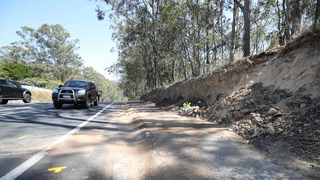 Queensland Fire and Emergency services were called to a single-car crash on Worongary Road in Worongary at around 8.30pm on Sunday. Police said ha man died in the crash at the intersection of Worongary Road and The Panorama. Relatives leave tributes left at the scene. Picture Glenn Hampson