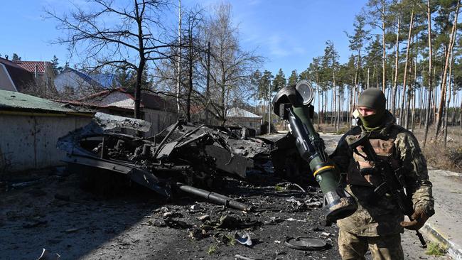 A Ukrainian soldier holds a Next Generation Light Anti-tank Weapon (NLAW) that was used to destroy a Russian armoured personal carrier north of Kyiv. Picture: AFP