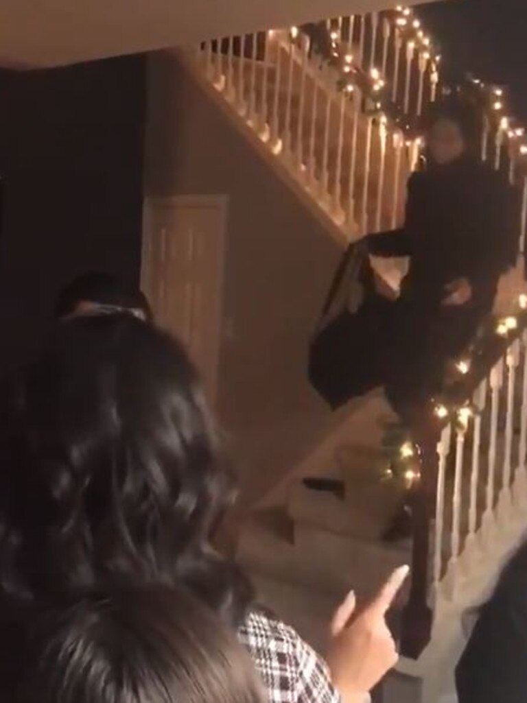 Ms Perea’s brother is seen bringing the shamed boyfriend’s bag down the stairs.