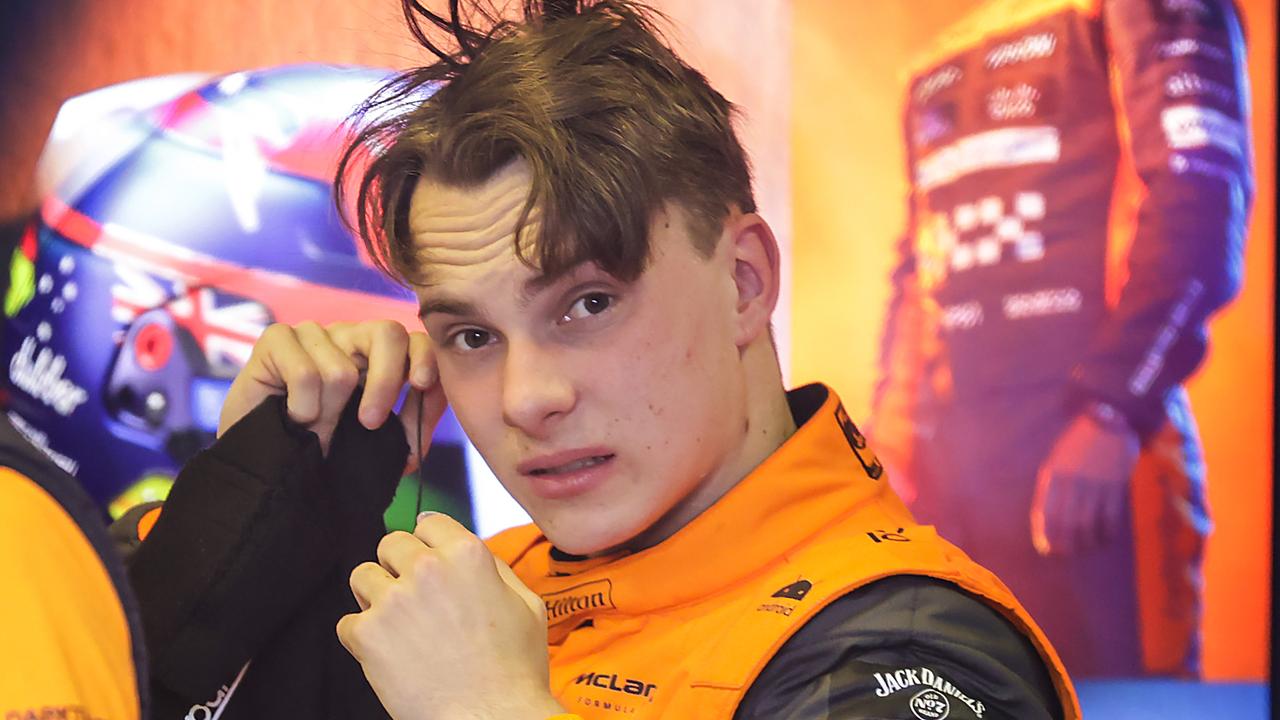 2023 Australian Grand Prix. Friday. Practice 2 Pits. McLaren driver Oscar Piastri removes his helmet after a wet Practice 2 in his pit garage. Picture: David Caird