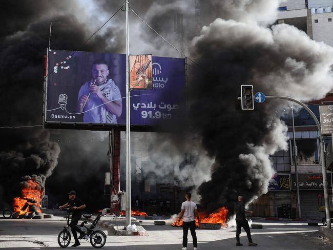 Palestinian youths burn tyres during confrontations with Israeli forces in the occupied West Bank city of Jenin. Picture: AFP