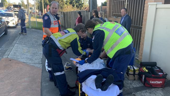 The girl being treated after she was hit by the car. Picture: CareFlight