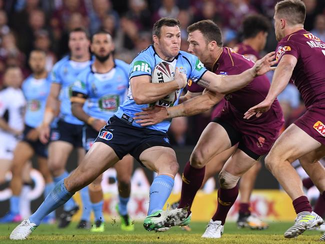 Brett Morris charges the ball up for the NSW Blues against Queensland last week. Picture: AAP