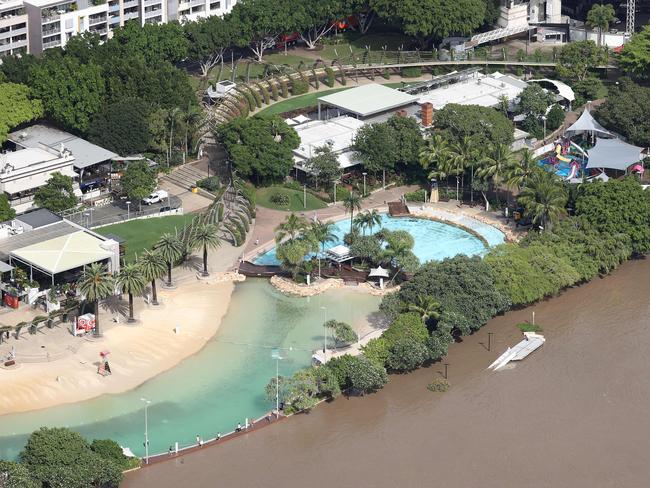 The flooded Brisbane River next to South Bank. Picture: Liam Kidston