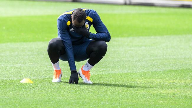 Usain Bolt struggles to recover at Central Coast Mariners training yesterday. Picture: AAP.