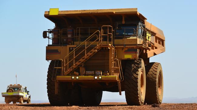 Giant mining tyres have been part of a Queensland first trial where they have been broken down to help resurface roads.