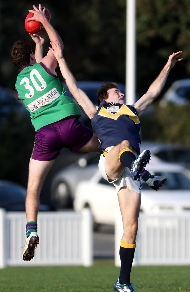 Marcus Nolan pulls down a big mark for Old Paradians against Whitefriars.