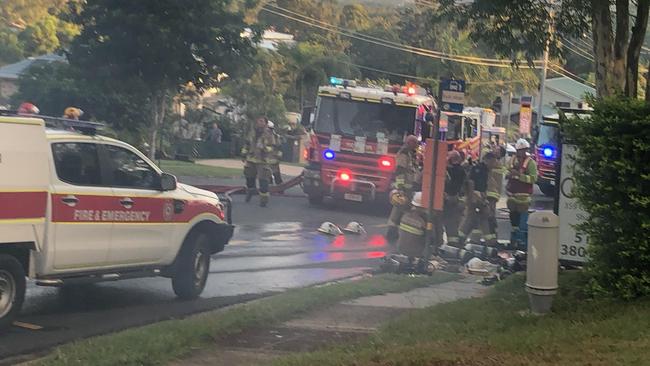 Fireys on Plantain Rd at Shailer Park where a family’s home was gutted when fire ripped through the split-level house on Monday afternoon. PHOTO: Jeni Faulkner