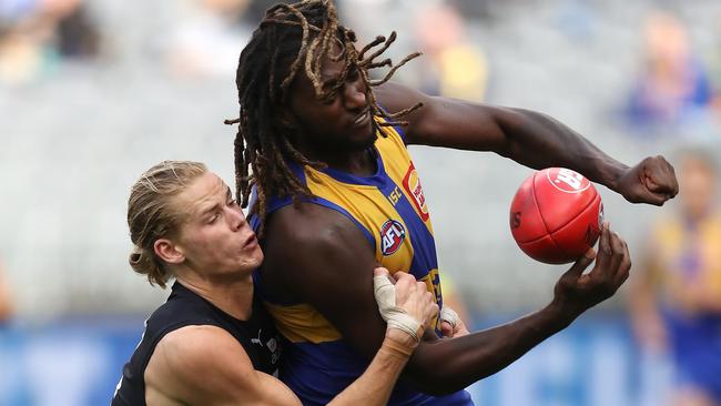 Tom De Koning tackles Nic Naitanui during the game on Sunday. Picture: Paul Kane/Getty Images