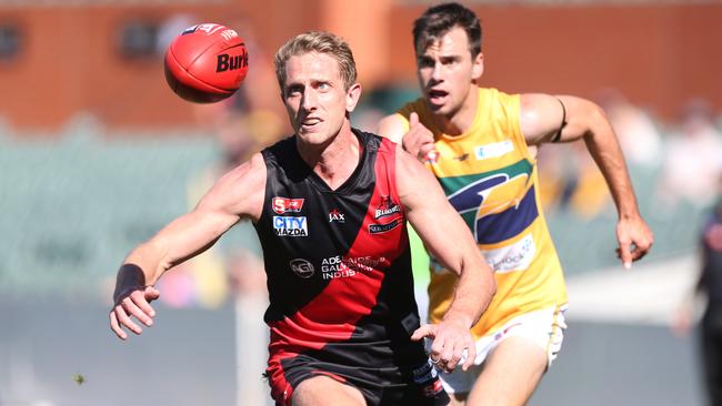 Chris Schmidt with eyes on the footy while playing for West Adelaide. He will be a playing coach in the country next season. Picture: Stephen Laffer