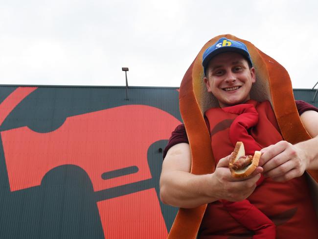 Josh Eastwell downs his final sausage in the great Australian hunt for the best Bunnings snag. Picture: (A)manda Parkinson