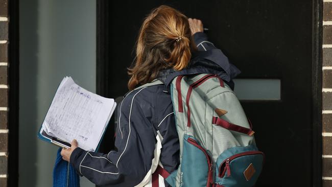 Victoria State Government Health and Human Services workers knocked on doors in Broadmeadows to check if people have any symptoms of COVID-19 and would like a test. Picture: Daniel Pockett/AAP