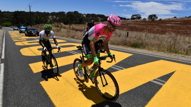 Australian cyclist William Clarke (right) of team EF Education First during stage one of the Tour Down Under from Port Adelaide to Lyndoch, South Australia, Tuesday, January 16, 2018. (AAP Image/David Mariuz) NO ARCHIVING, EDITORIAL USE ONLY