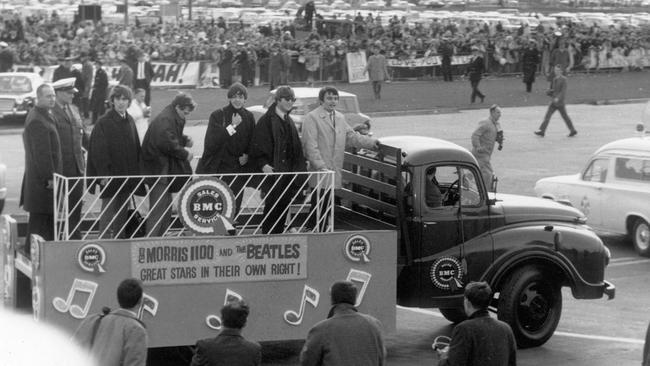 June 14, 1964: The Beatles were put on a flat-bed truck after their arrival at Essendon Airport where over 5,000 screaming fans were waiting to see their idols. Melbourne. Picture: Herald Sun Image Library