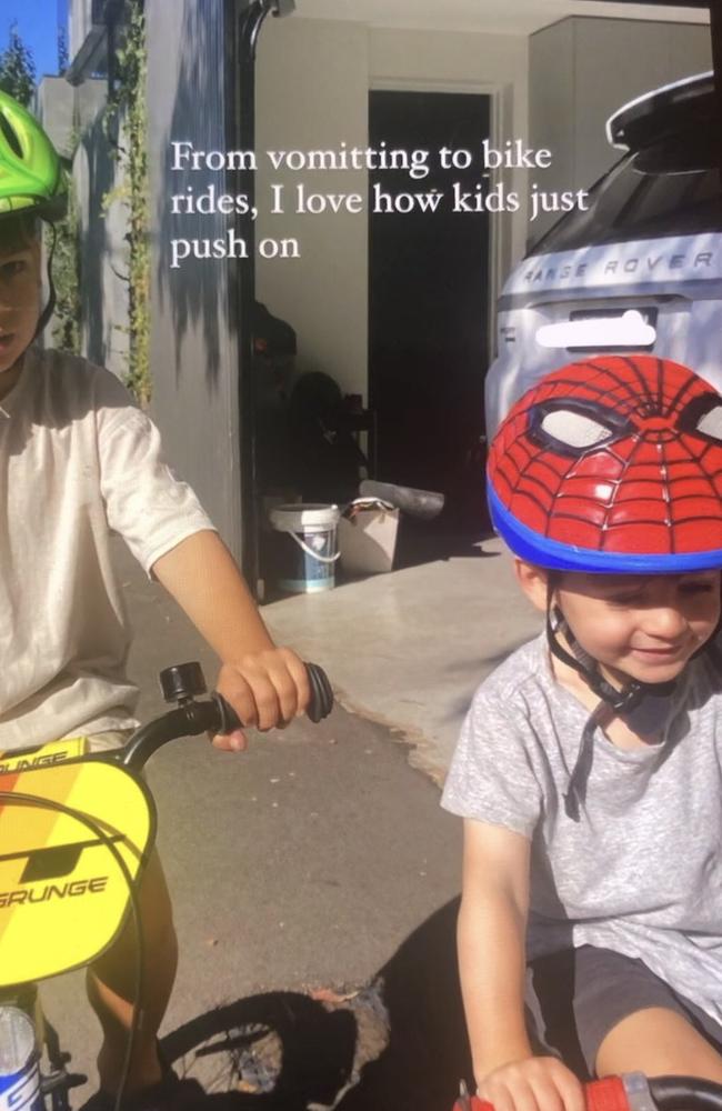 Little Henley on his bike wearing a Spiderman helmet after his bout of illness.