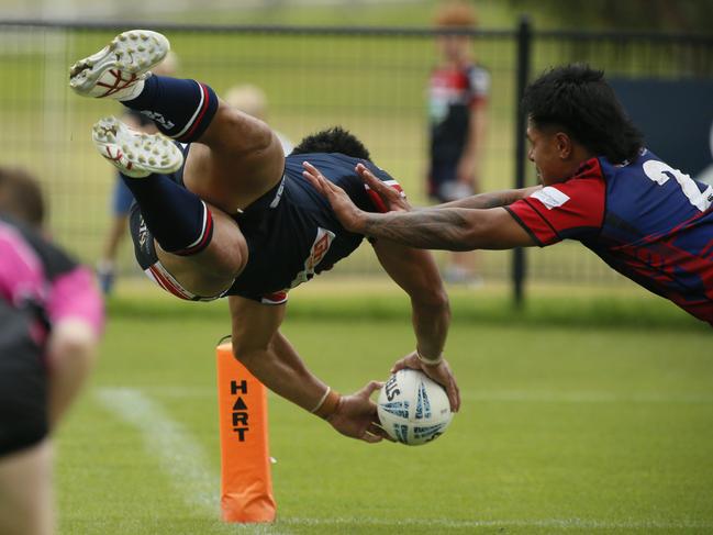 A try-bound Eddie Aiono takes flight for Camden. Picture: Warren Gannon Photography