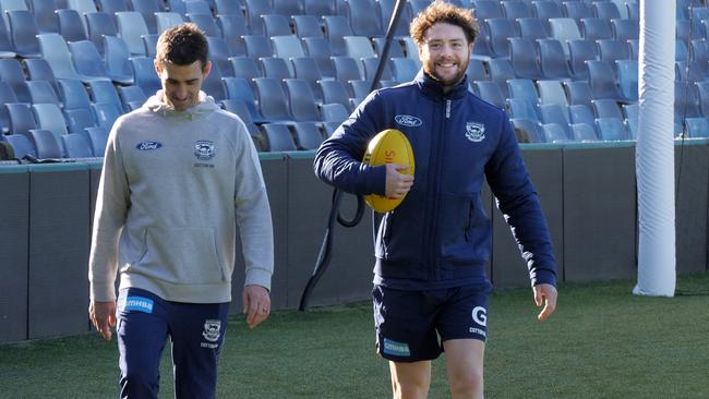 Jack Steven, right, walking laps of GMHBA Stadium after rejoining his Geelong teammates on Monday. Picture: Geelong Cats