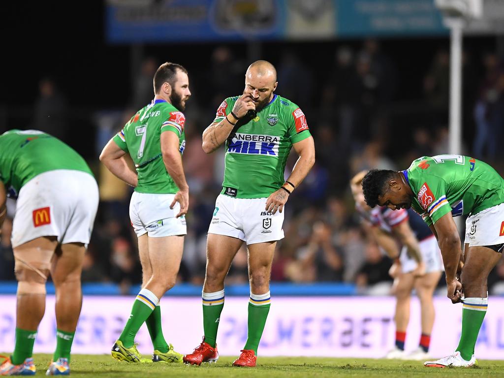 Josh Hodgson of the Raiders and team mates look dejected after their defeat during the round 25 NRL match between the Canberra Raiders and the Sydney Roosters at BB Print Stadium, on September 02, 2021, in Mackay, Australia. Picture: Albert Perez