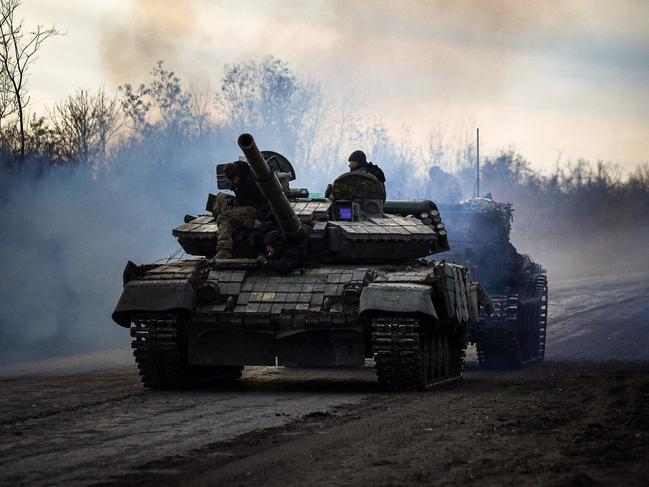 A Ukrainian tank rolls on a road near Bakhmut, in the Donetsk region, on November 30, 2022, amid the Russian invasion of Ukraine. (Photo by ANATOLII STEPANOV / AFP)