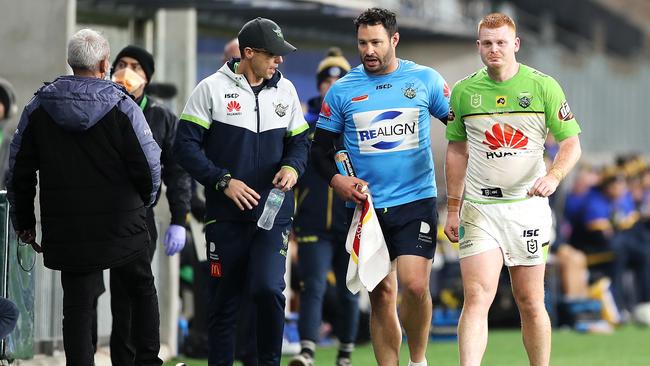 Brett White helps Corey Horsburgh from the field after the injury. Picture: Mark Kolbe/Getty Images